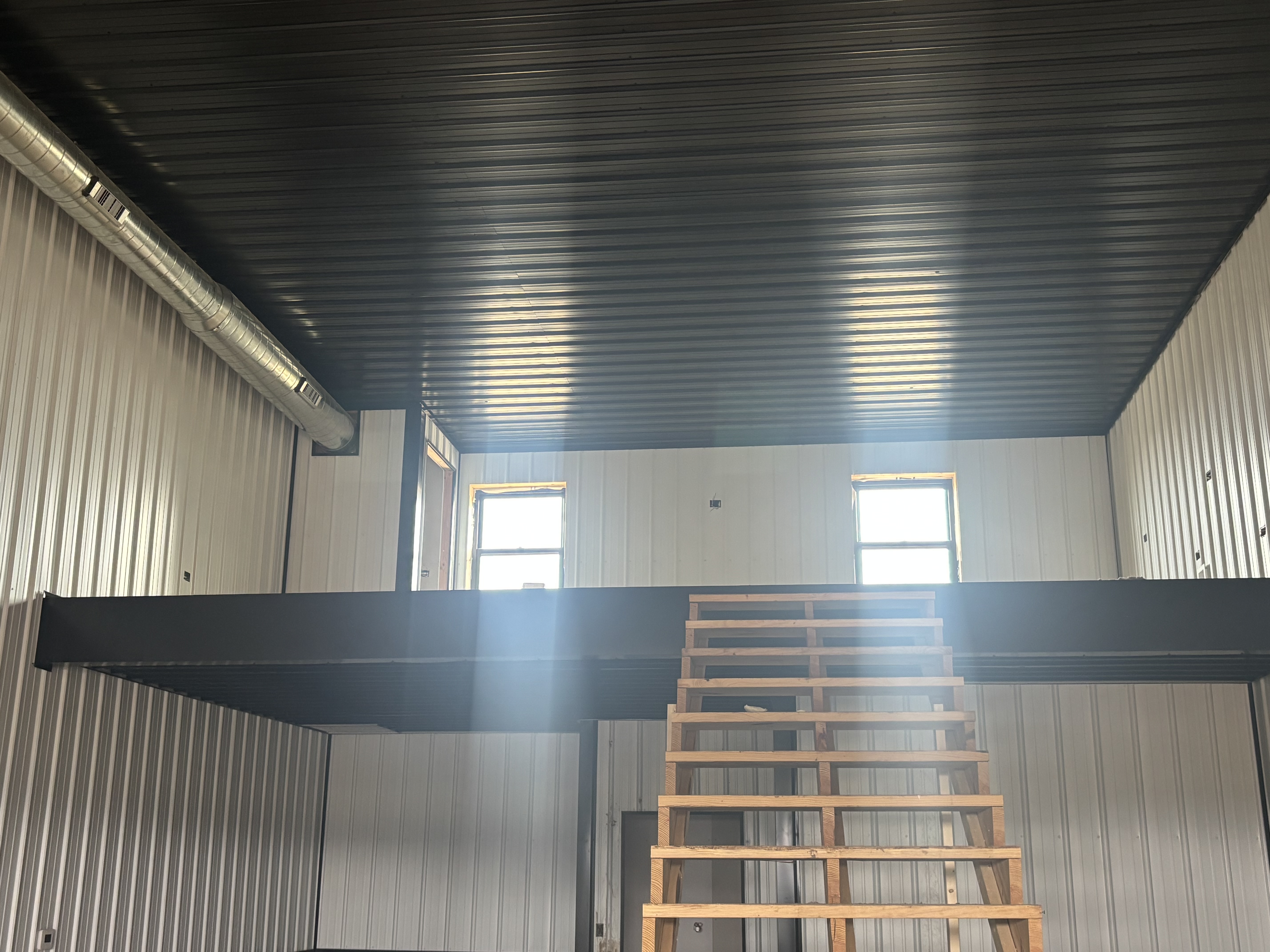 Construction progress — exterior siding and stone work