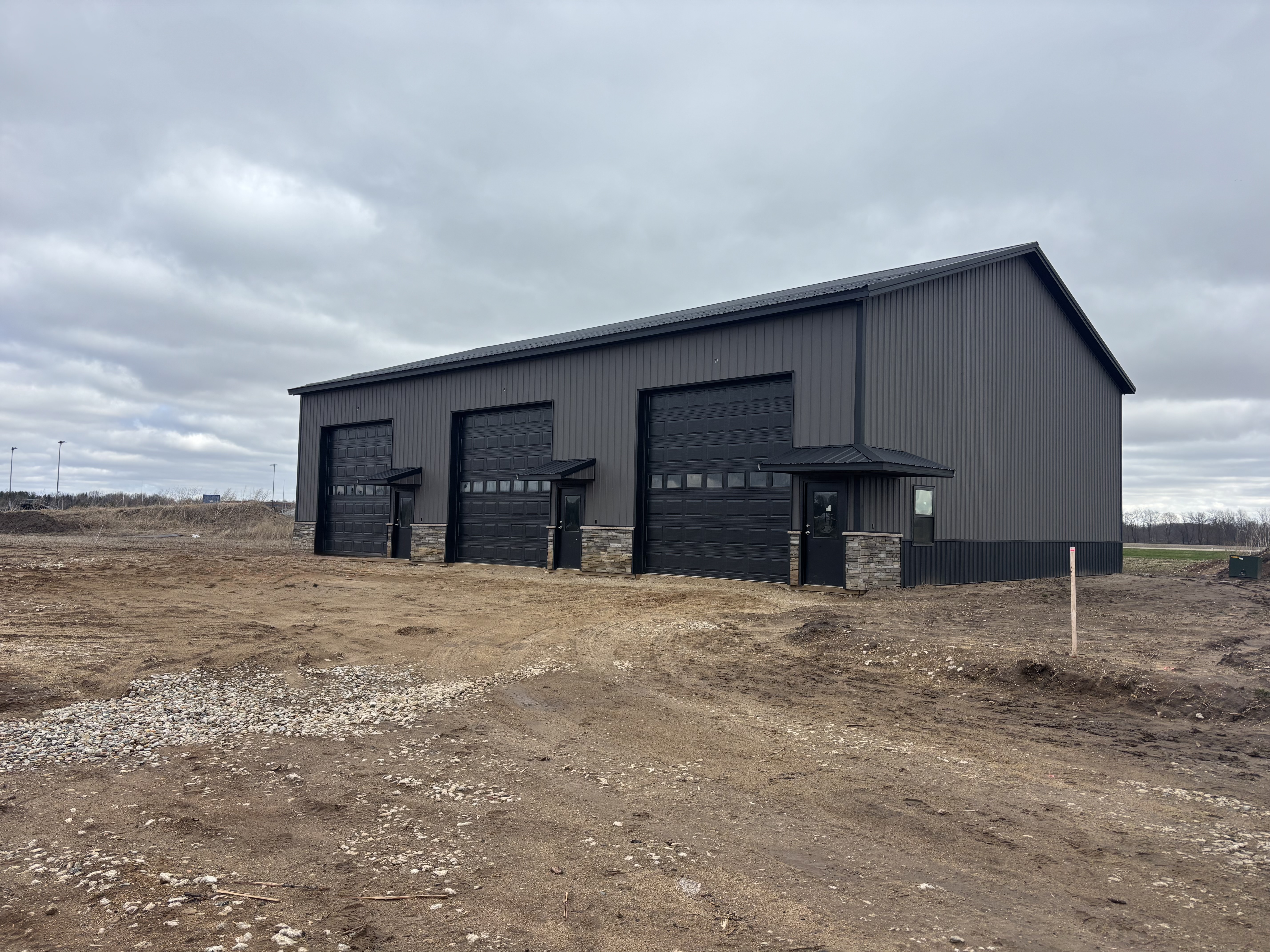 Post-frame building progress — exterior nearly complete
