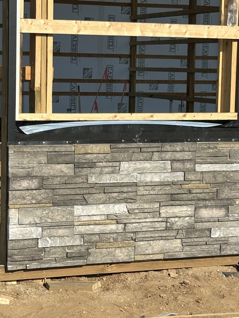 Versetta stone veneer and window opening during exterior finish