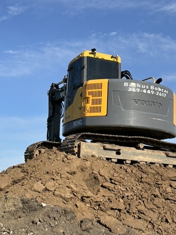 Excavator on site during grading and excavation